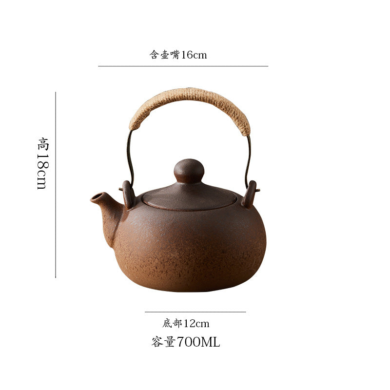 Traditional heat-resistant ceramic tea kettle with overhead handle for charcoal fire.
