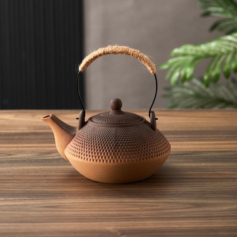 Modern Zen-style textured ceramic teapot with precision pour spout.